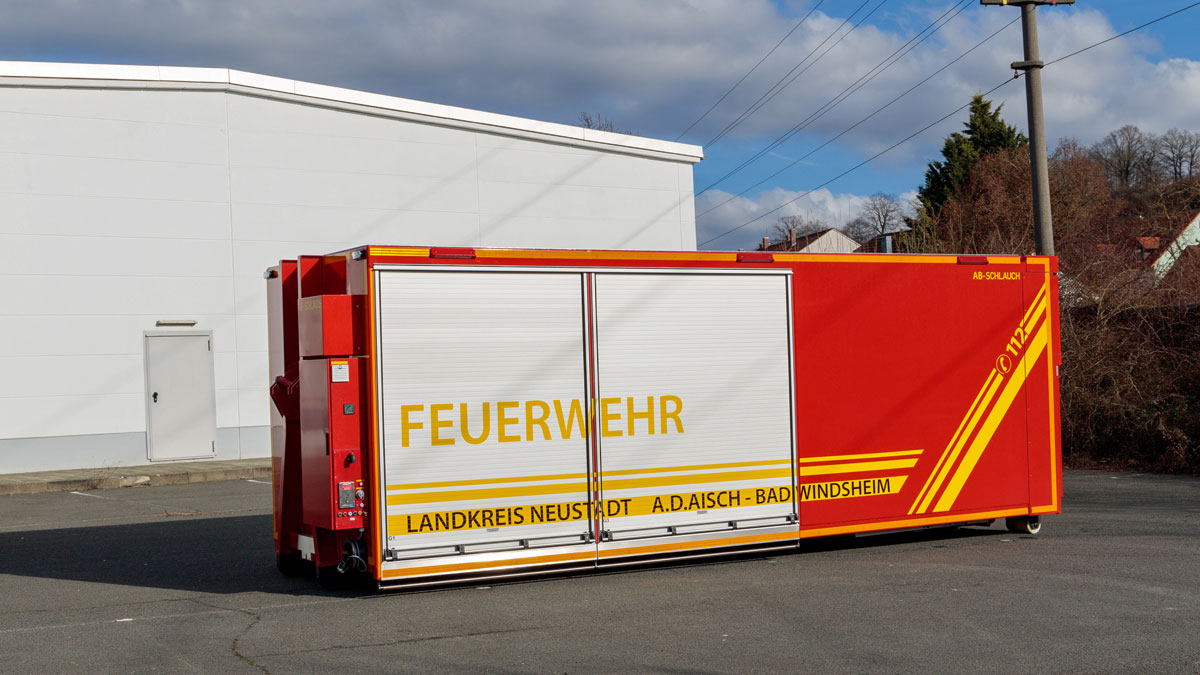 Abrollbehälter Schlauch